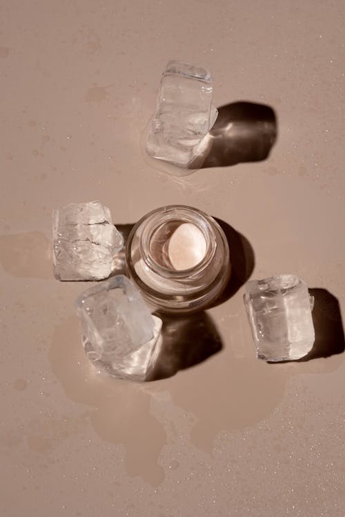 Free Cosmetic Product beside Crystals Stock Photo