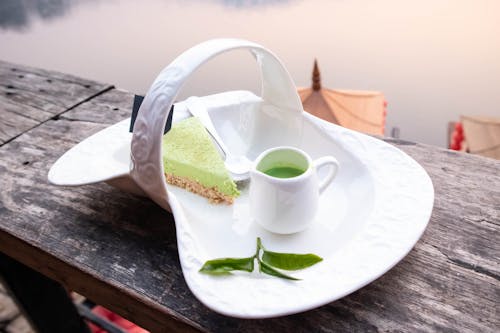 Photo of Match Cake and Matcha Drink on a Porcelain Plate