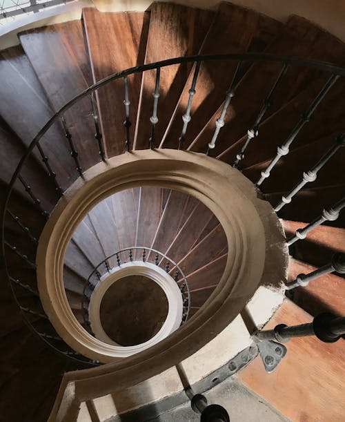Brown Wooden Spiral Staircase with Metal Railings