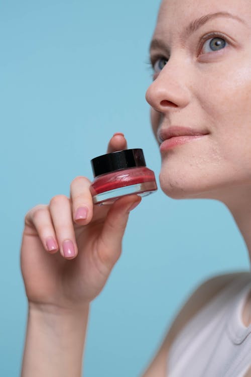 Free Woman Holding Red Lipstick Stock Photo