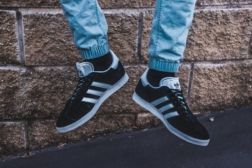 Free Photography of a Person Wearing Adidas Gazelle Stock Photo