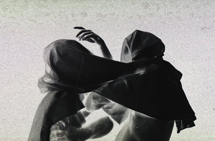 Abstract Photo Of People Wearing Hoods On Head