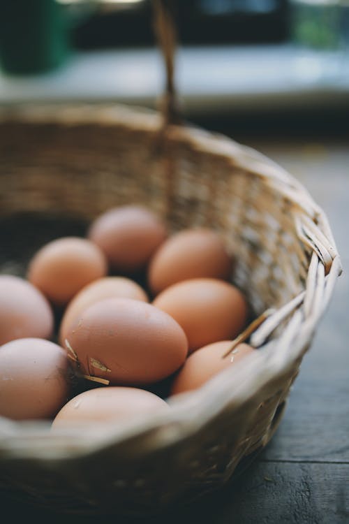 Free Brown Eggs on Woven Basket Stock Photo