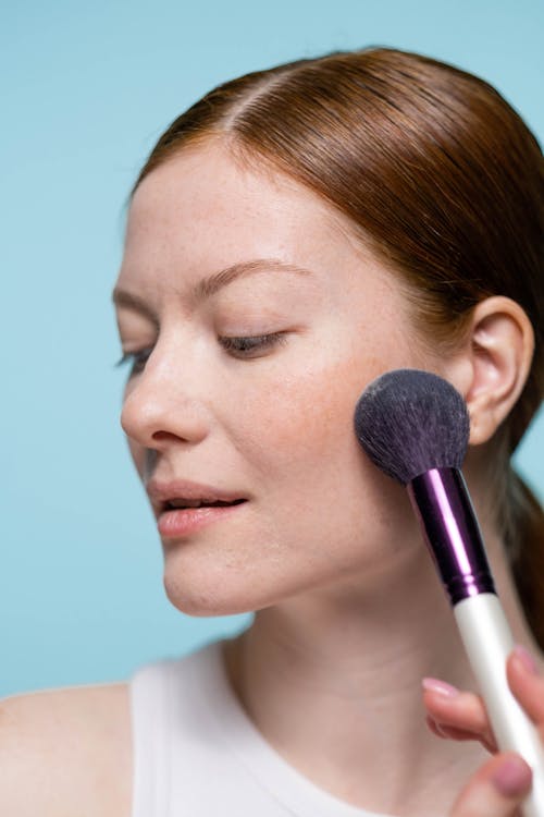 Woman Applying Blush On