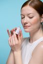 Woman in White Tank Top Holding A Lipstick