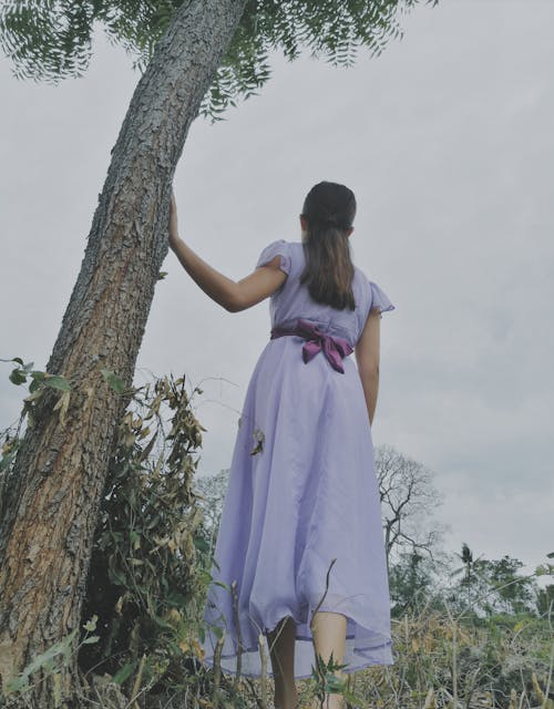 Low-Angle Shot of a Woman in Purple Dress