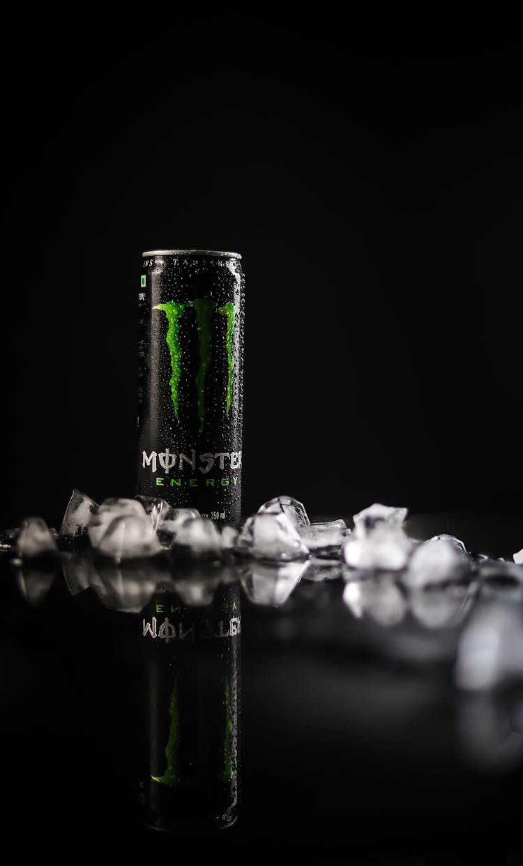 Monster Energy Tin Can On Black Surface 