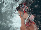 Aerial View of Red and White Boat on Shore