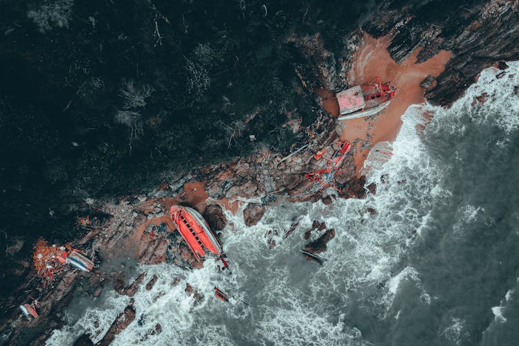 Top View Of Shipwrecks On Rocky Coastline