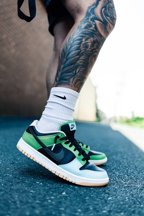 Free Person Wearing Nike Sneakers Stock Photo