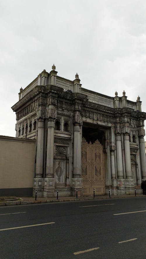 Concrete Building with Pillars Under White Sky