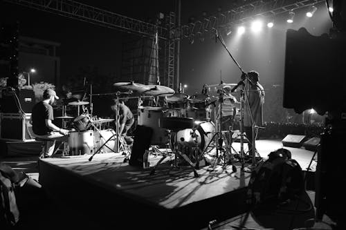 Grayscale Photography of Band on Stage