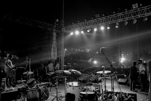 Captivating black and white image of a live concert stage setup at night in Ahmedabad, India.