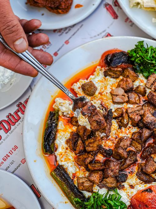 Free A flavorful Turkish kebab dish served with vegetables, captured from above for a vibrant look. Stock Photo