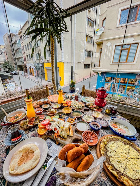 A lavish Middle Eastern breakfast spread on a balcony overlooking a city street. Perfect for food lovers.