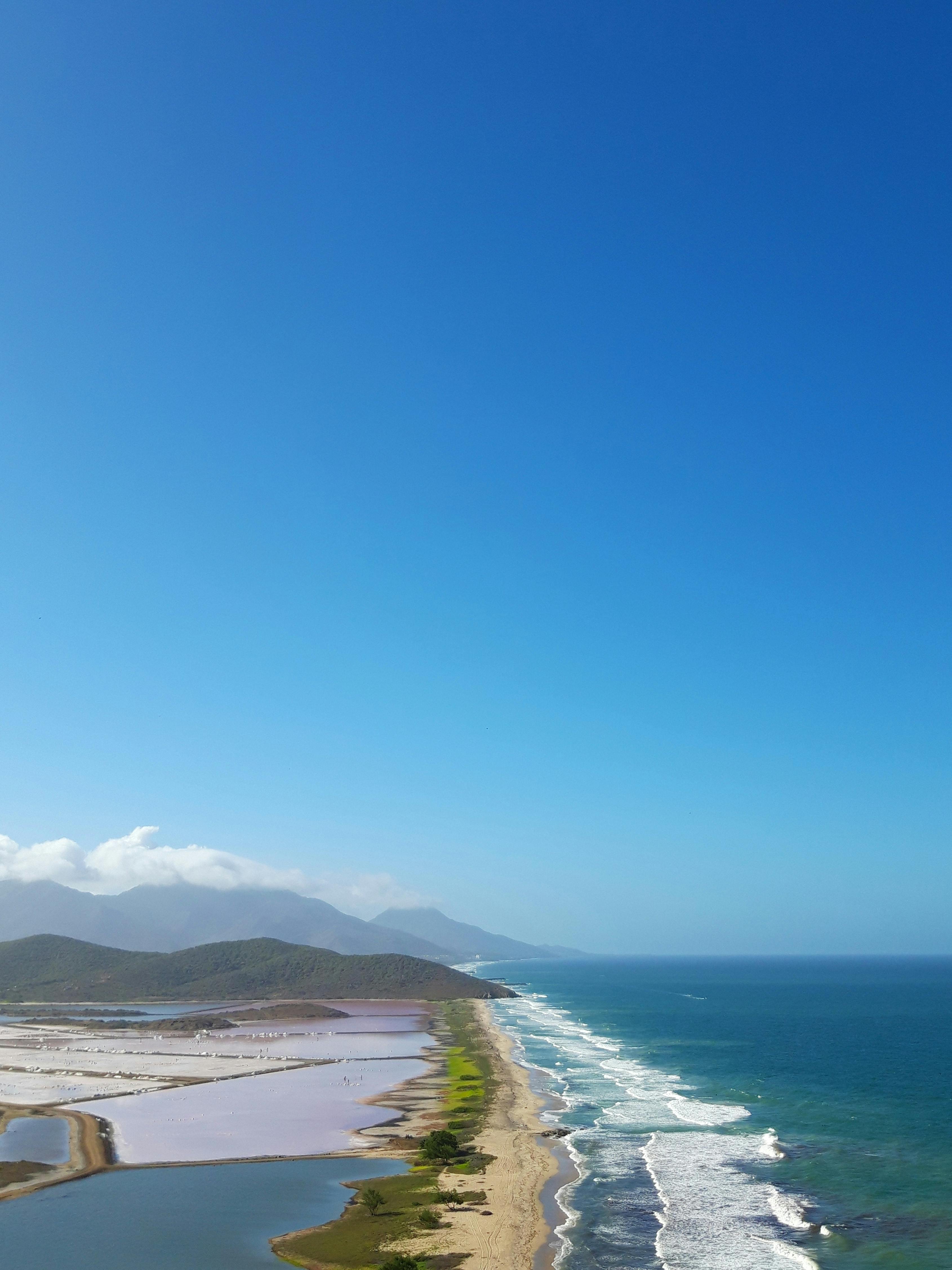 blue sea under blue sky