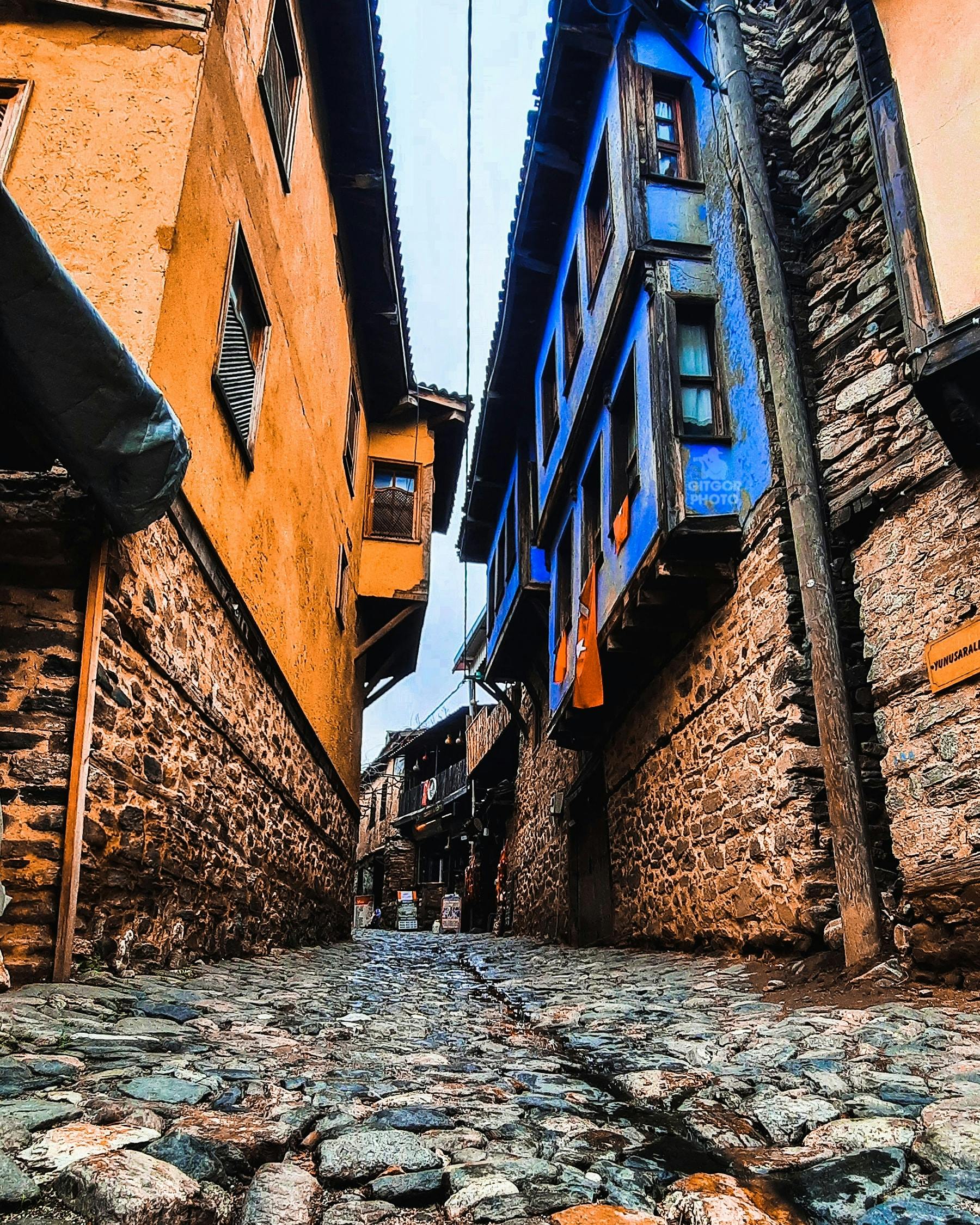 Person in a city wearing warm clothes and holding tissues during cold season