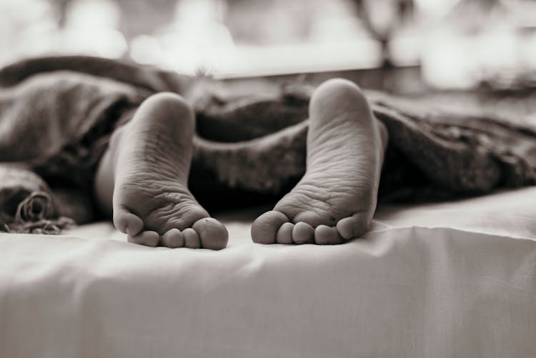 Person's Barefoot In Monochromatic Photography