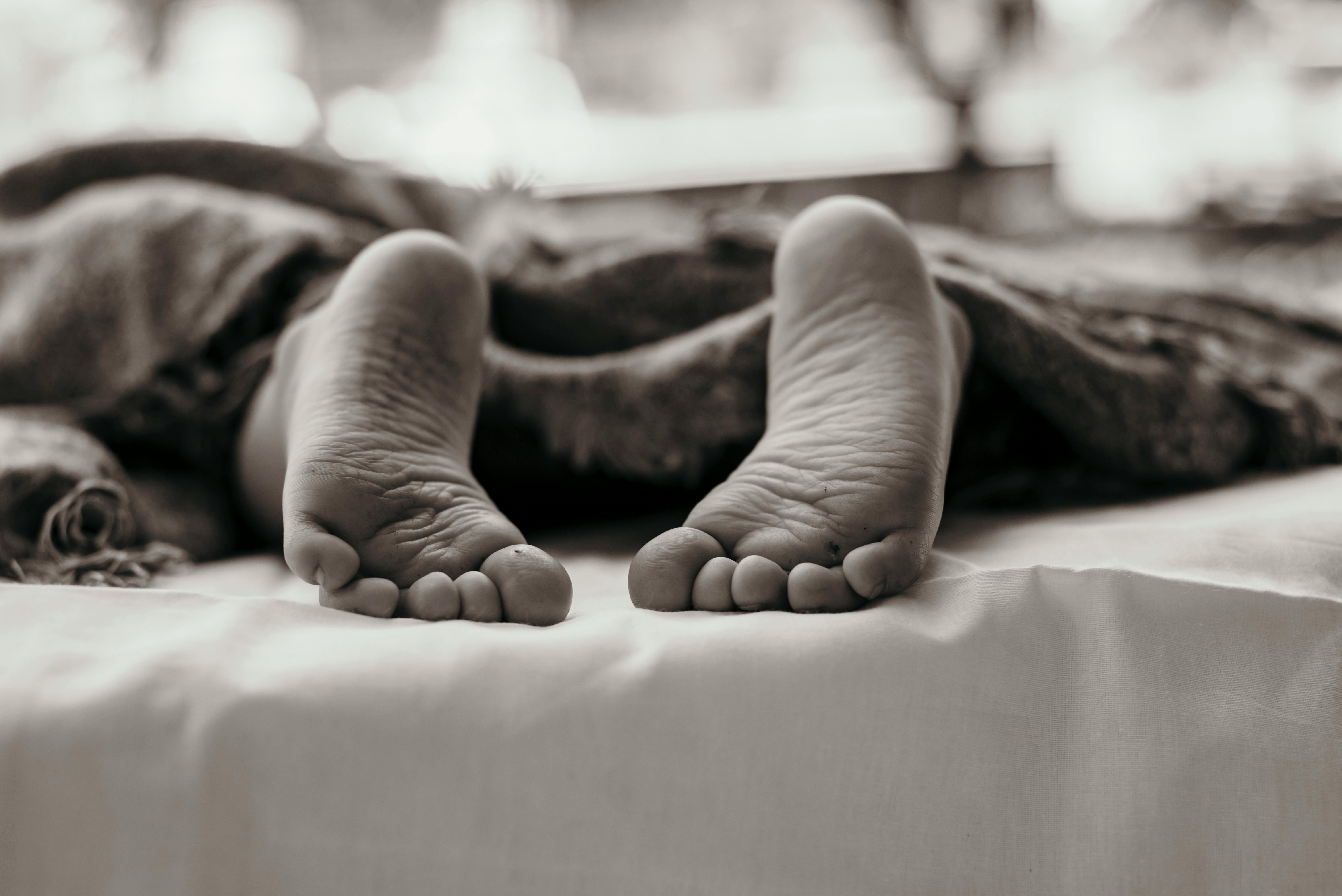Person's Barefoot in Monochromatic Photography · Free Stock Photo