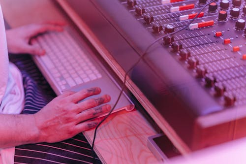 Hands of a Person Working in a Recording Studio