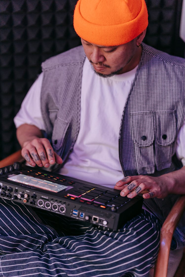 A Man Using A Music Sequencer