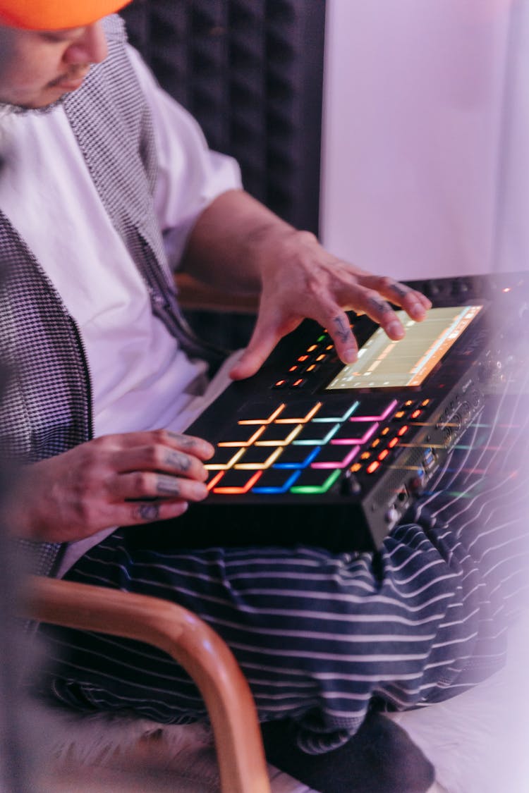 A Man Using A Music Sequencer