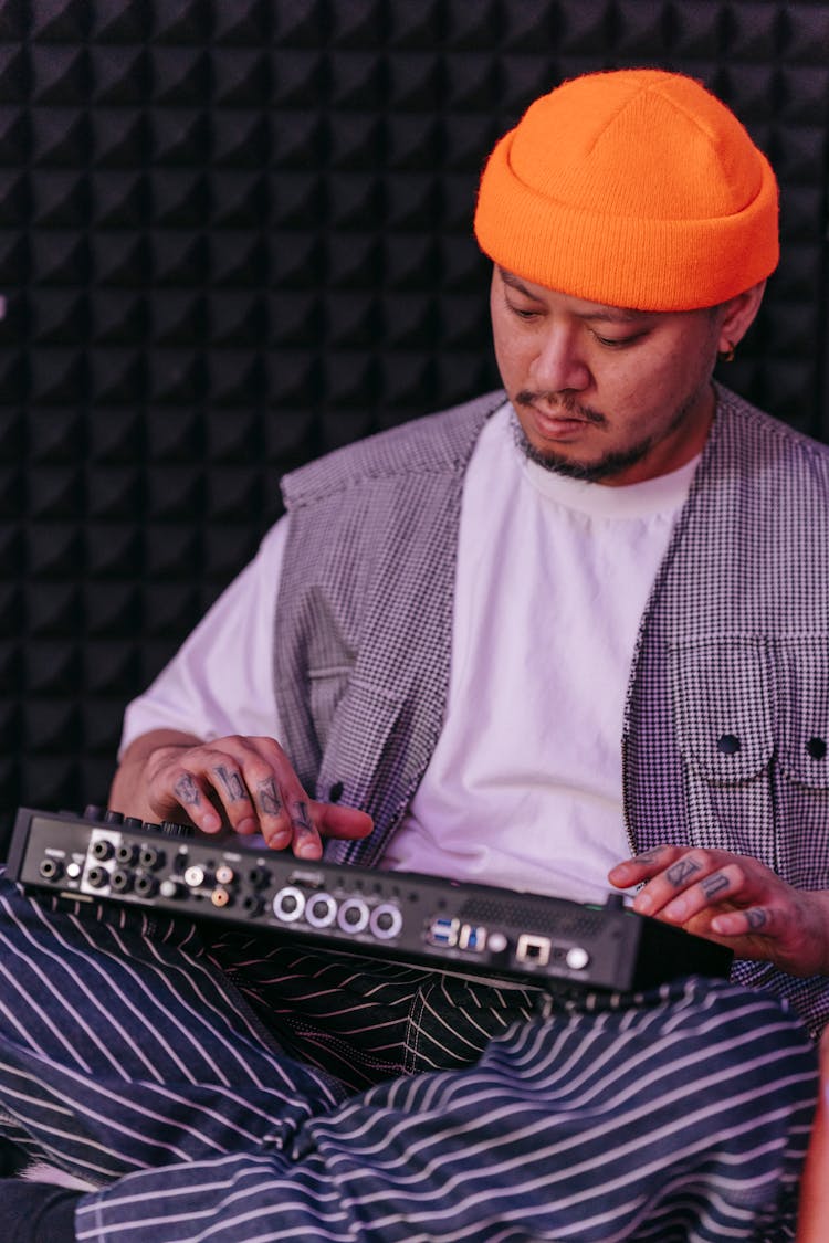 A Person Using Drum Machine