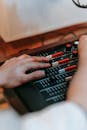 A Person Using a Music Mixer