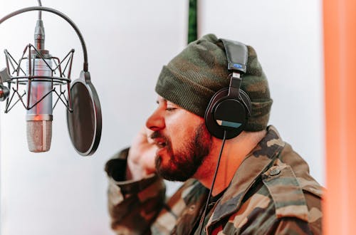 A Man Recording at the Music Studio