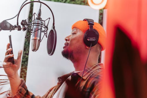 Free Man Singing in Studio Stock Photo