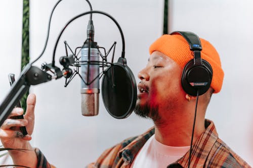 Free A Man using Condenser Microphone Stock Photo