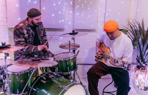 Men Playing Musical Instruments