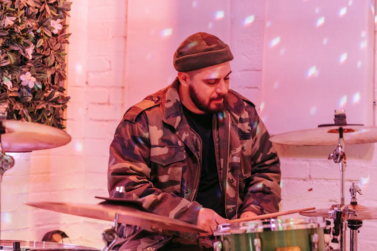 Man In Beanie Hat Playing Drums