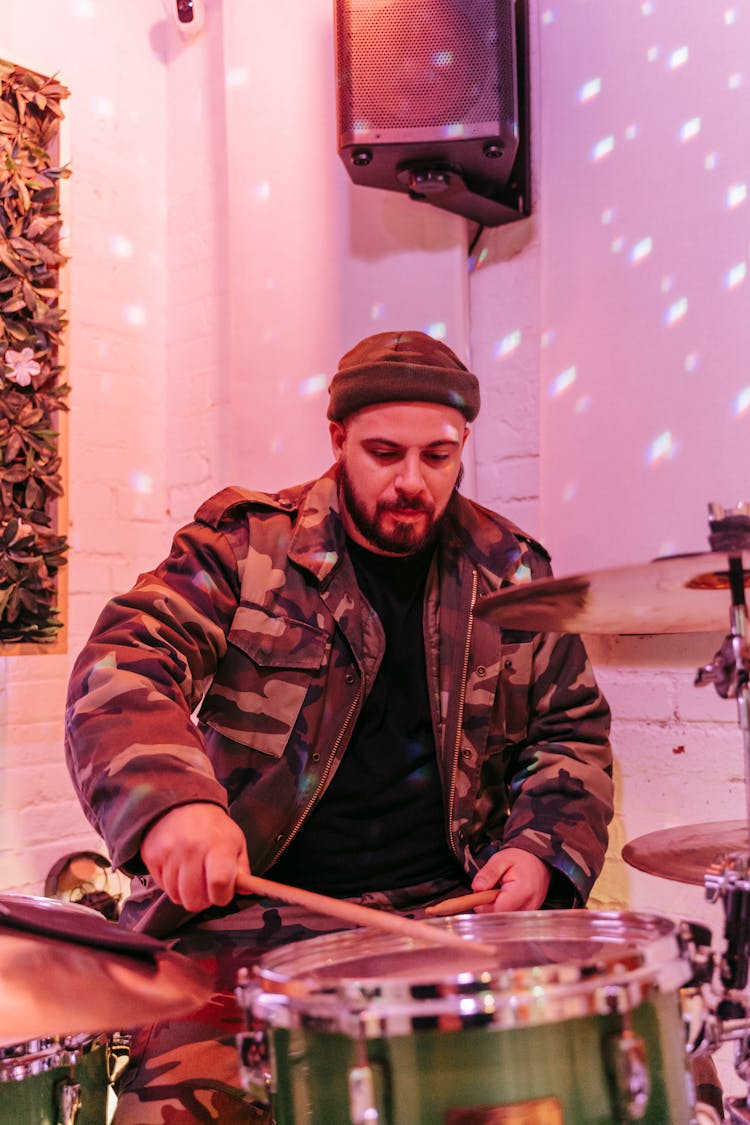 Bearded Man Playing On A Drum Kit