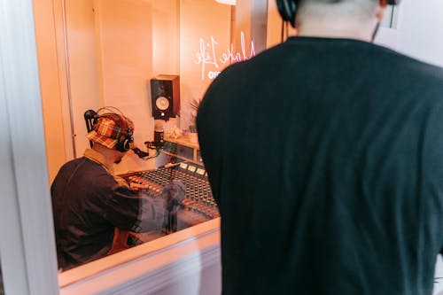 Photo of Two Men in a Recording Studio