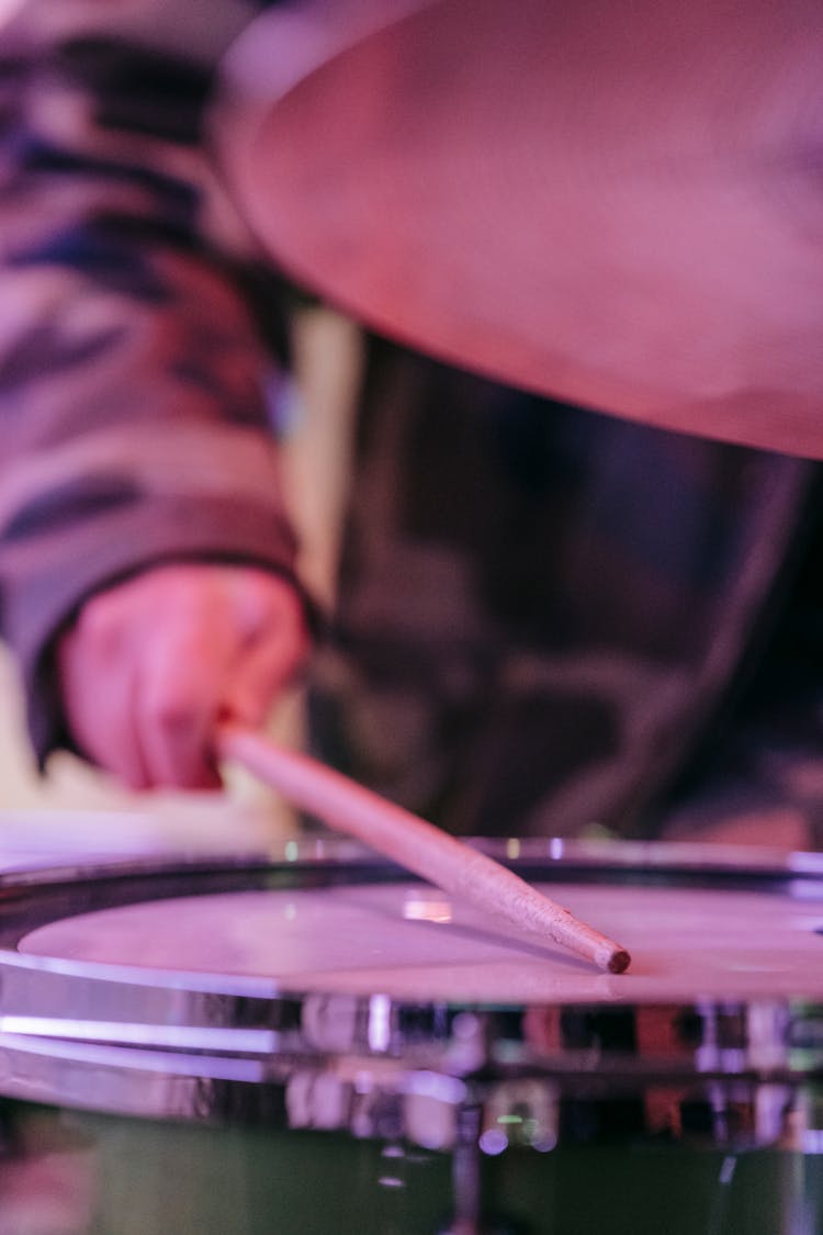 Hand Hitting Drum With Drumstick