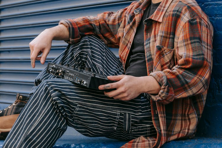 Person Holding Drum Machine