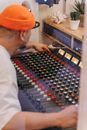 Man in White Dress Shirt Wearing Orange Cap