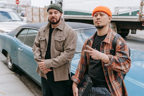 Men Standing Near the Blue Vintage Car 