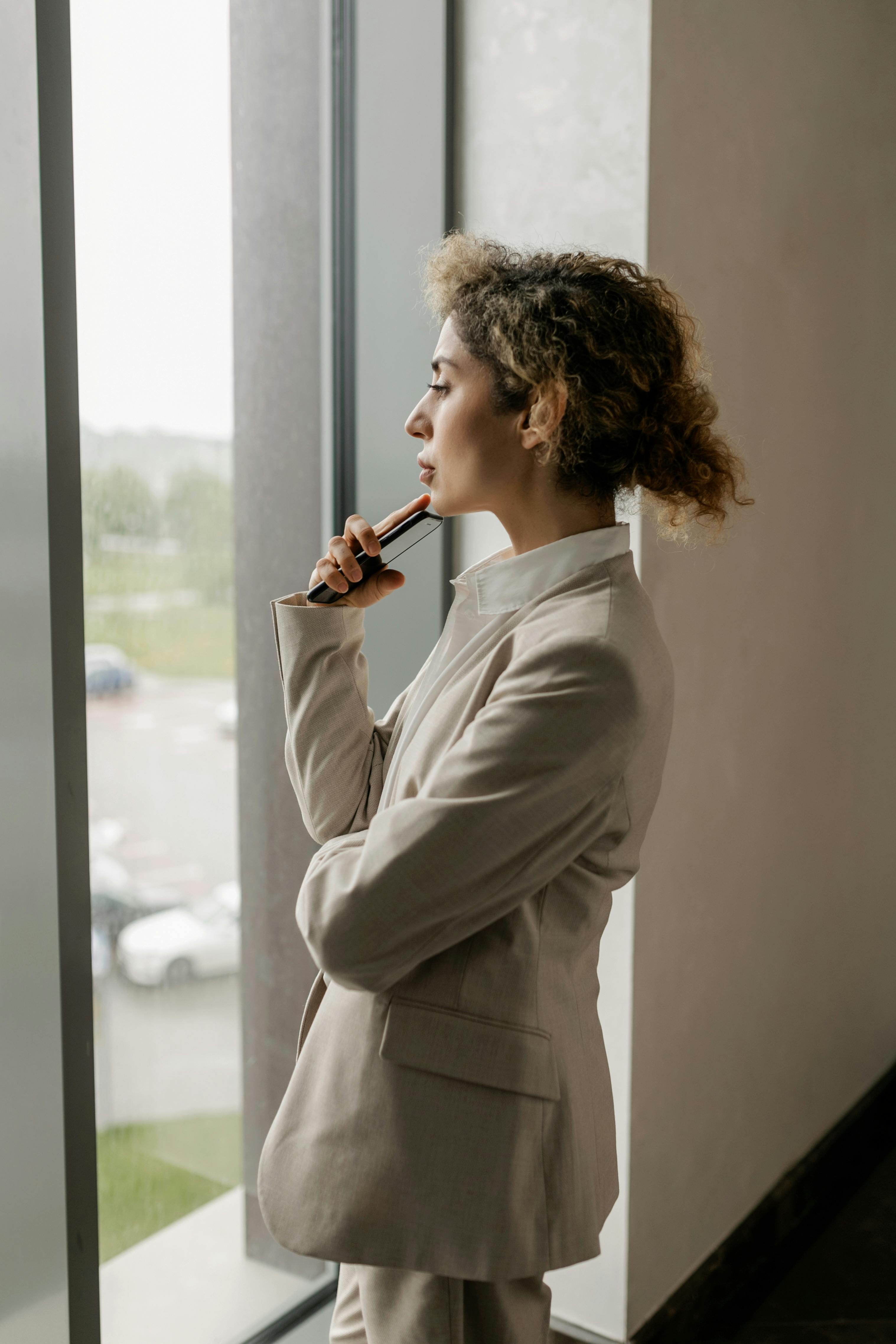 a woman looking out the window