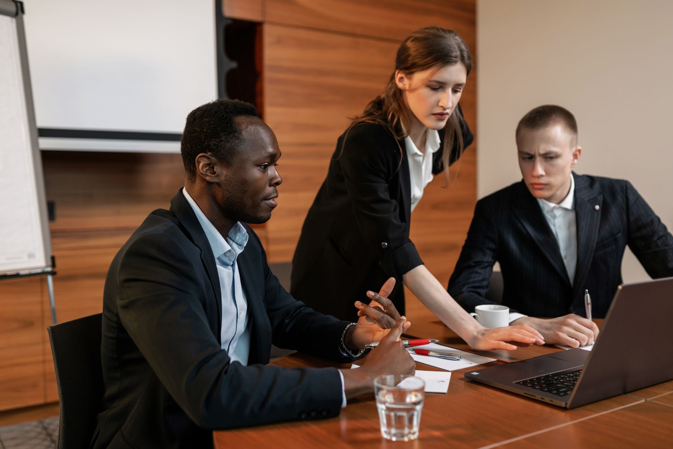 Professional team collaborating around a table in a modern office
