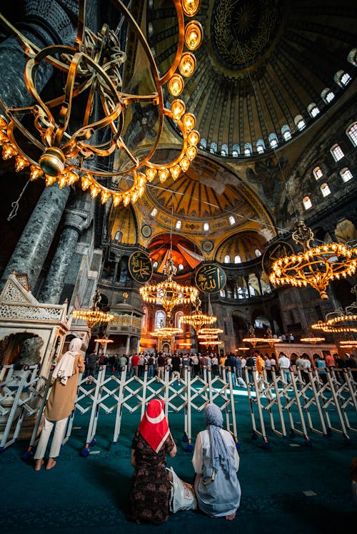 A Back View of People Facing the Altar