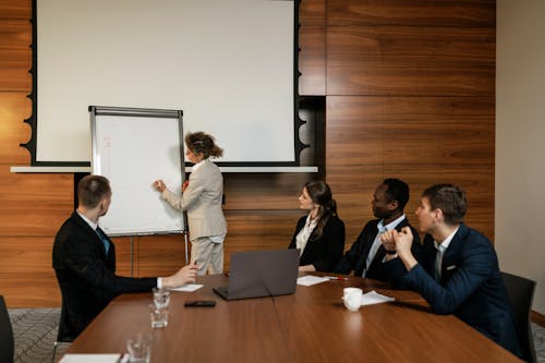 People in Business Suit Sitting at the Table