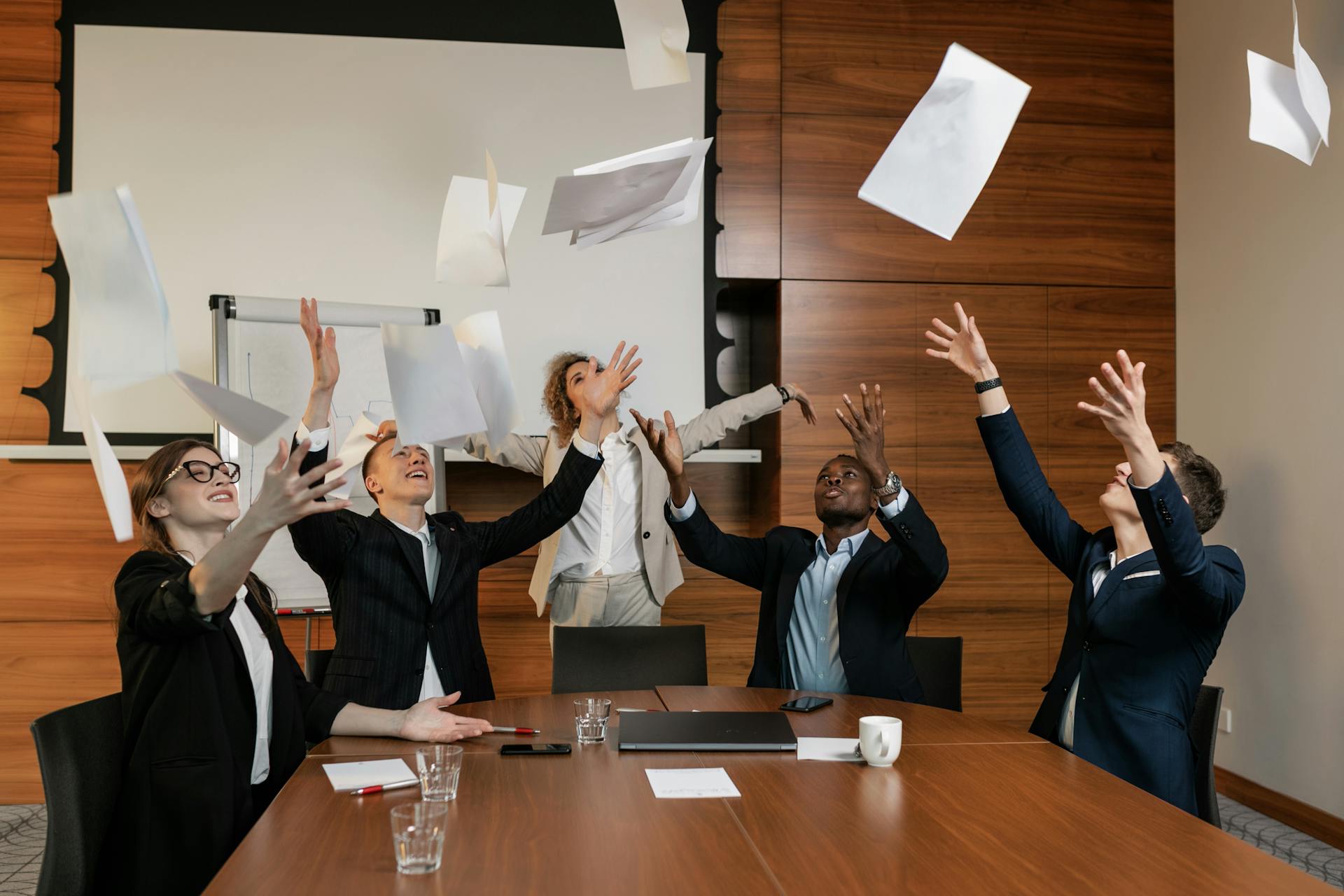 People in Business Suit Throwing White Papers