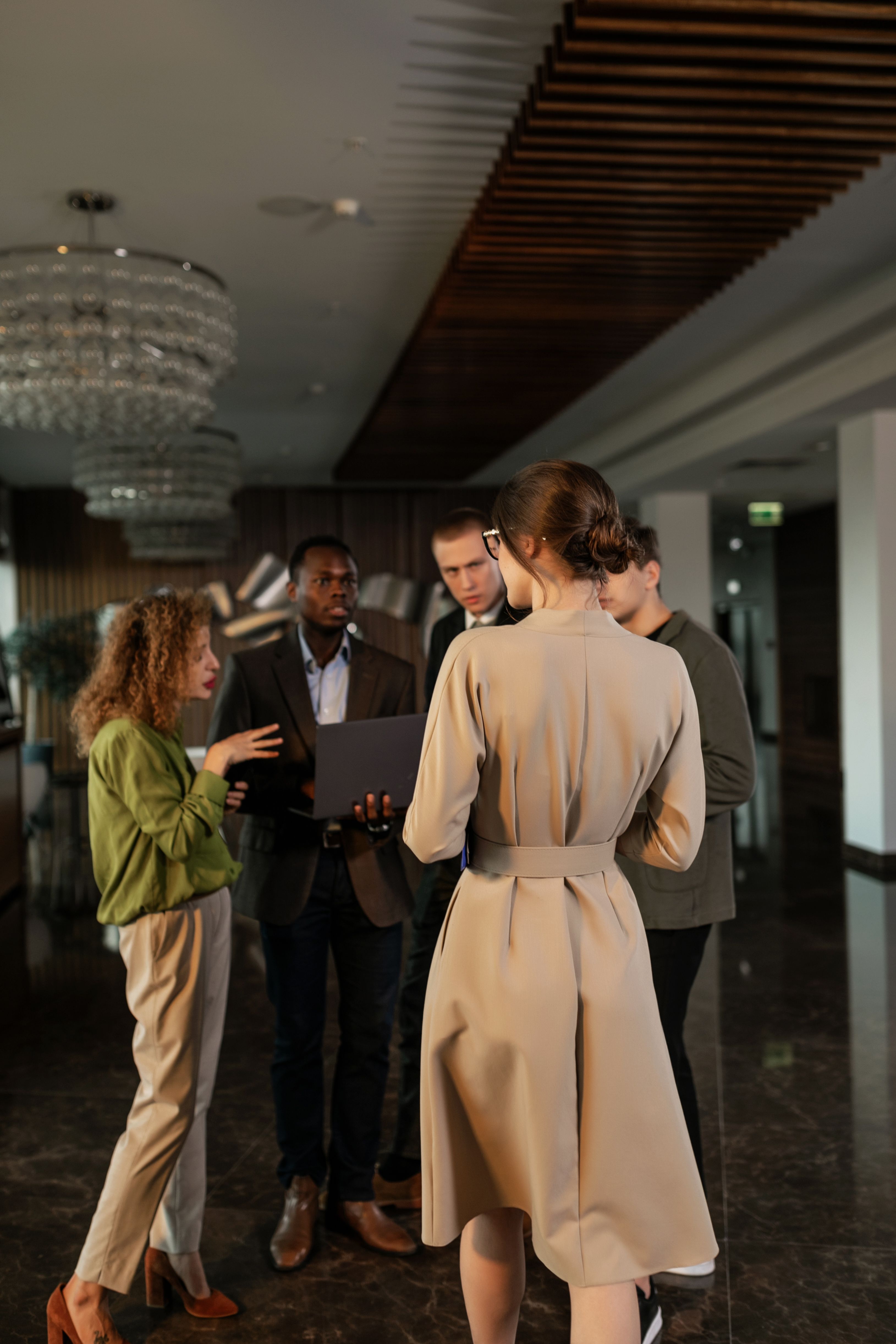 Group of People Standing Inside Room Having Discussion · Free Stock Photo