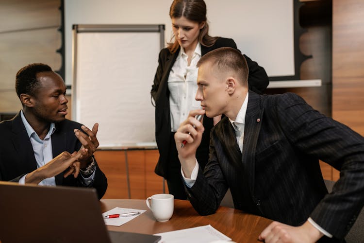 A People Talking Together In The Office