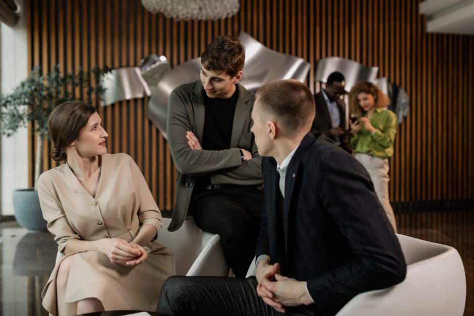 Client team in discussion in a modern office — photo by Alena Darmel on Pexels