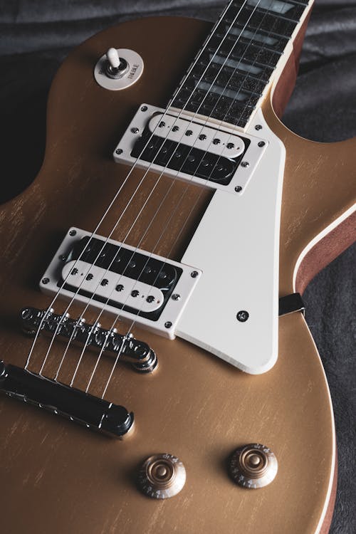 Free Electric Guitar on the Gray Textile Stock Photo