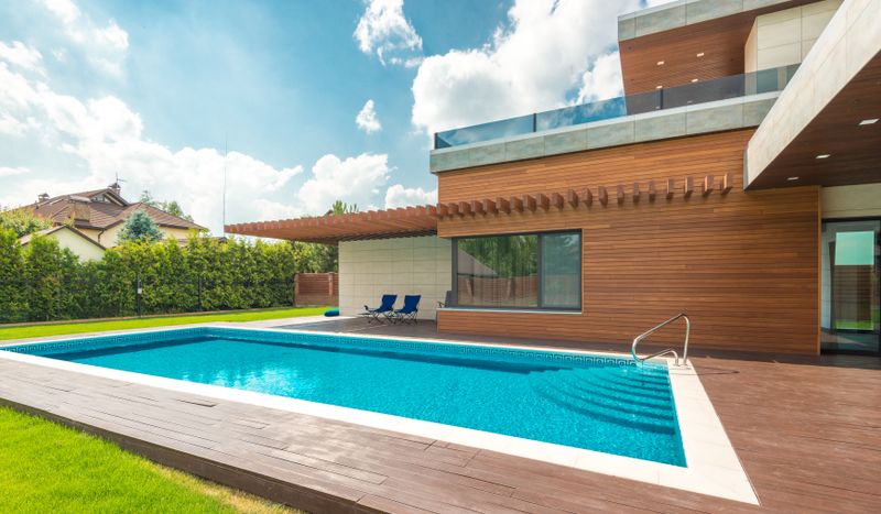 Custom gunite pool with modern home