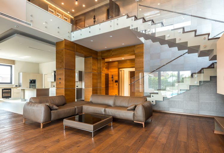 Brown Leather Couch On Parquet Flooring